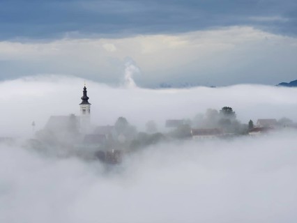 Church rises out of the morning mist, Frauenberg pilgrimage church, near Leibnitz, Styria, Austria,