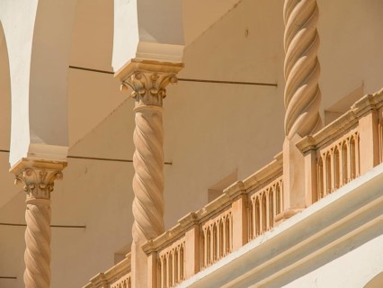 Beige columns and arches of a building with architectural details, Tunis in Africa with ruins from