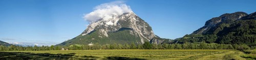 Freshly mown meadow, Grimming mountain range in the morning light, panoramic shot, near Irdning,