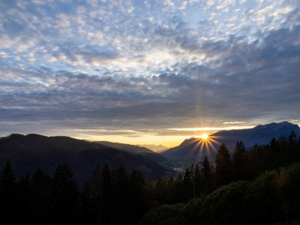 Cloudy mood, sunset over the Eisenerz Alps, mountain massif Reiting, in the Liesingtal the village