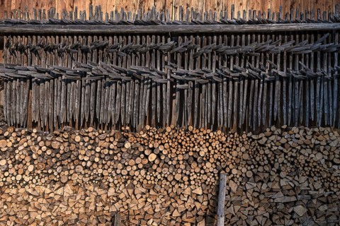 Stacked firewood and hanging hay, hay dryer at a barn, Bad Oberdorf, Allgaeu, Bavaria, Germany,