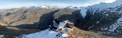 Mountain panorama and glacier, mountain hut Ramolhaus in autumn with snow, view of Gurgler Ferner