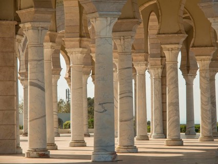 White columns and arches in historic Mediterranean architecture in the sunshine, Tunis in Africa