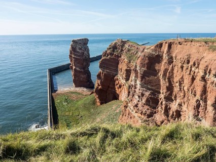 Expansive cliff landscape by the sea with clear sky, Heligoland, Germany, Europe