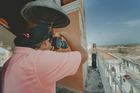 Tourists taking photographs at the viewpoint of the La Merced church, Granada. Tourist couple