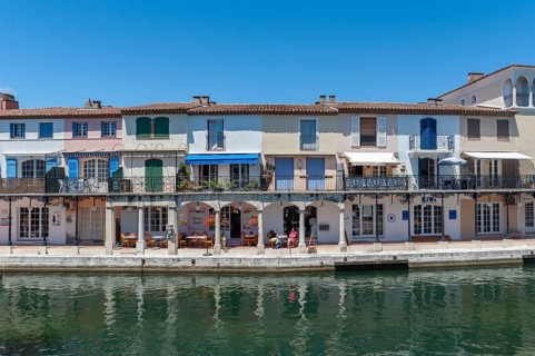 Townscape with restaurants and shops at the Pont principal du port grimaud, Port Grimaud, Var,