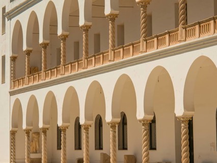 Historic building with sandstone arches and colonnades, Tunis in Africa with ruins from Roman