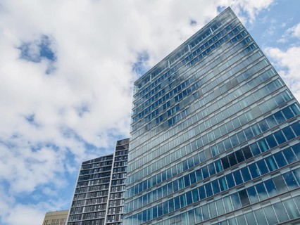 Modern skyscrapers with glass facades in Luxembourg under a slightly cloudy sky, modern buildings