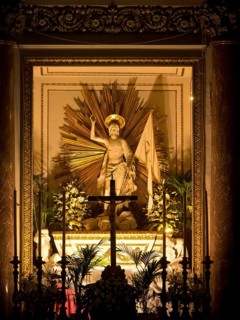 Magnificently decorated altar with statue of a saint and golden rays, palermo in sicily with an