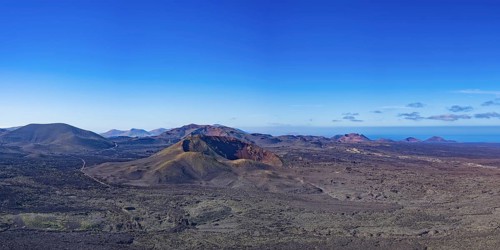 Panorama from the crater rim of Caldera Blanca to the fire mountains in the Parque National de