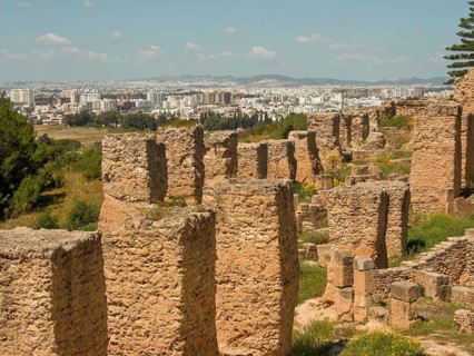 Overview of ancient ruins set against a modern urban landscape, Tunis in Africa with ruins from