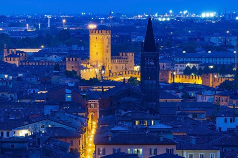 View of the illuminated Castelvecchio castle and the church of San Lorenzo, Verona, Veneto, Italy,