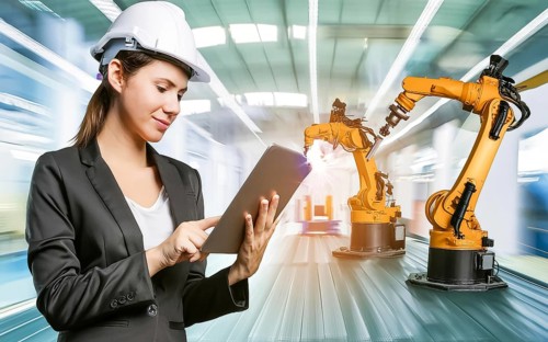 Industrial engineer with tablet control, automation of robotic arms, intelligent monitoring, AI