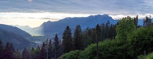 Sunlight falls on the Liesingtal valley and on the village of Traboch, Schoberpass federal road,