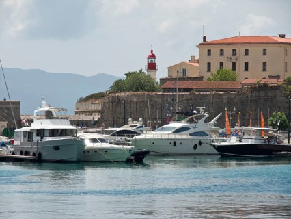 Harbour with several luxury yachts, a building and a lighthouse, Corsica, ajaccio, France, Europe