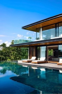 Luxurious wooden house with swimming pool reflecting the opulence of billionaires nestled in