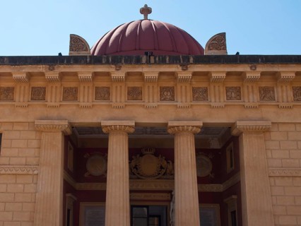 An impressive facade with columns and a dome in the background, palermo in sicily with an
