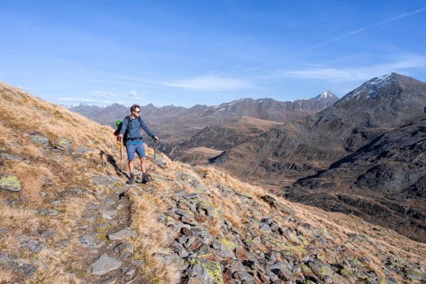 Mountaineer on a hiking trail, Gurgler Seenplatte, behind mountain peak of the Gurgler ridge, in