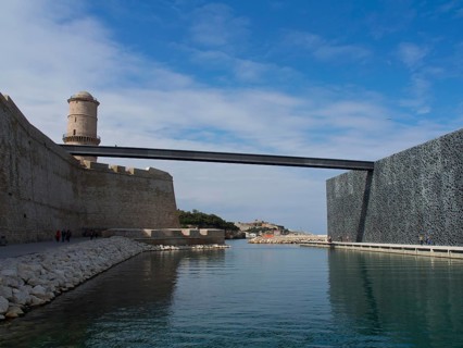Historic castle with bridge and moat, winter sky in the background, Marseille on the Mediterranean