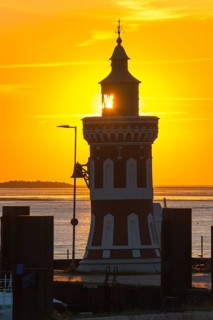 Pingelturm, historic lighthouse with bell in the harbour, close-up, atmospheric, golden, beautiful