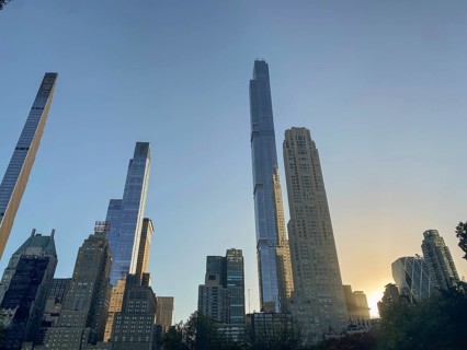 Cityscape at sunset with modern skyscrapers and the central park in the foreground, the skyline of