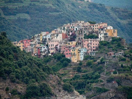 A mountain village with colourful houses nestled in green terraces and nature, Bari, Italy, Europe