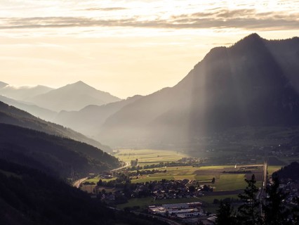 Sunlight falls on the Liesingtal valley and the village of Traboch, Schoberpass federal road, view