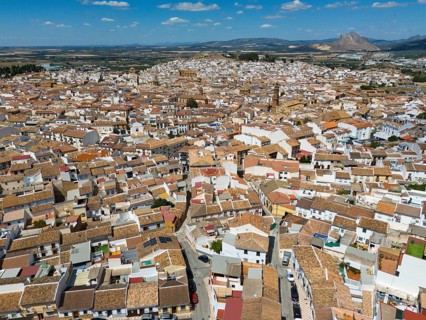 Aerial view of a picturesque spanish town with tightly packed rooftops and narrow streets