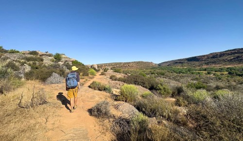 Hikers on the Seville Art Rock Trail, dry landscape with rock formations, Cederberg Mountains, near