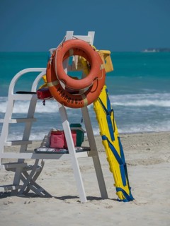 Lifeguard station with life buoy and ladder on the beach, Abu Dhabi, United Arab Emirates, Asia