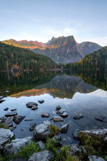 Mountain peaks of the Oetztal Alps reflected in Lake Piburger See, in autumn, near Oetz in Oetztal,