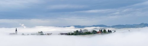 Church rises out of the morning mist, Frauenberg pilgrimage church, panoramic view, near Leibnitz,