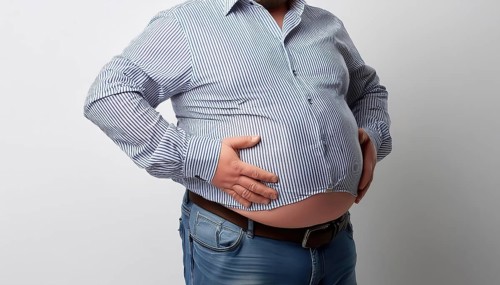 Overweight, A man in a shirt and jeans shows his round fat belly, AI generated, AI generated