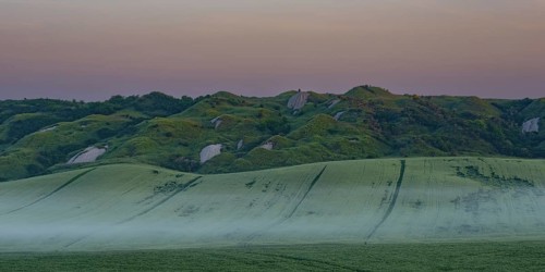 Early morning fog shortly in front of sunrise in the Crete Senesi, Province of Siena, Tuscany,