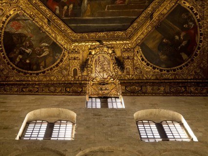 Richly decorated ceiling of a historic building with frescoes and gilded ornaments, The city of