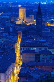 View of the illuminated Castelvecchio castle and the church of San Lorenzo, Verona, Veneto, Italy,