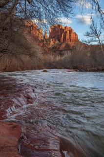 Cathedral Rock sandstone formations tower over Oak Creek at the Crescent Moon Picnic Site in