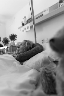Senior citizen with dementia lying in her room in a retirement home, portrait, Baden-Wuerttemberg,