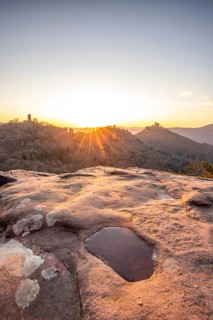 View of Trifels Castle, from Engels Landing rock, with the young tower in autumn at sunset.