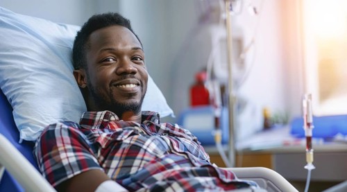 Black patient in the hospital waiting for doctor visit him and check his health status, AI