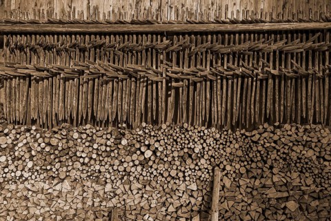 Stacked firewood and hanging hay, hay dryer at a barn, Bad Oberdorf, Allgaeu, Bavaria, Germany,
