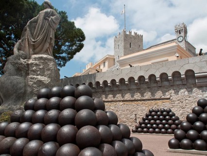 A historic fortress with statues and cannonballs in front of a building, Monte Carlo, Monaco,