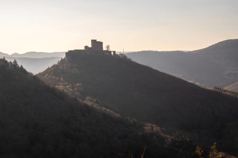 View of Trifels Castle, from Engels Landing rock, with the young tower in autumn at sunset.
