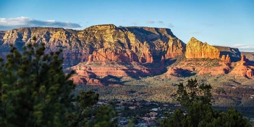 Evening sun lights up the red rock limestone formations surrounding Sedona, Arizona, United States