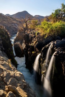 Epupa Falls waterfall on the Kunene River backlit, long exposure, Kunene, Namibia, Africa