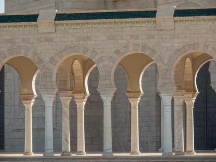 Sandstone columns and arcades with arches that cast shadows in daylight, Tunis in Africa with ruins