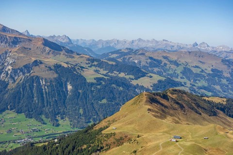 Picturesque view over valleys and mountains with scattered villages and clear distant views,