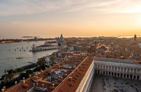 St Mark's Square and Basilica di Santa Maria della Salute on the Grand Canal at sunset, view from