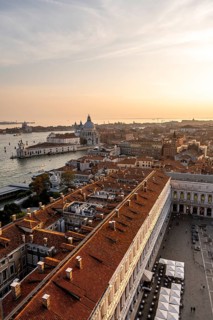 St Mark's Square and Basilica di Santa Maria della Salute on the Grand Canal at sunset, view from