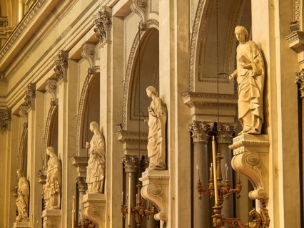 Detailed statues in a baroque church with golden elements and a sacred atmosphere, palermo in